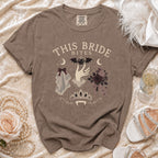 Brown t-shirt with "This Bride Bites" graphic featuring vampire fangs and gothic bridal elements.