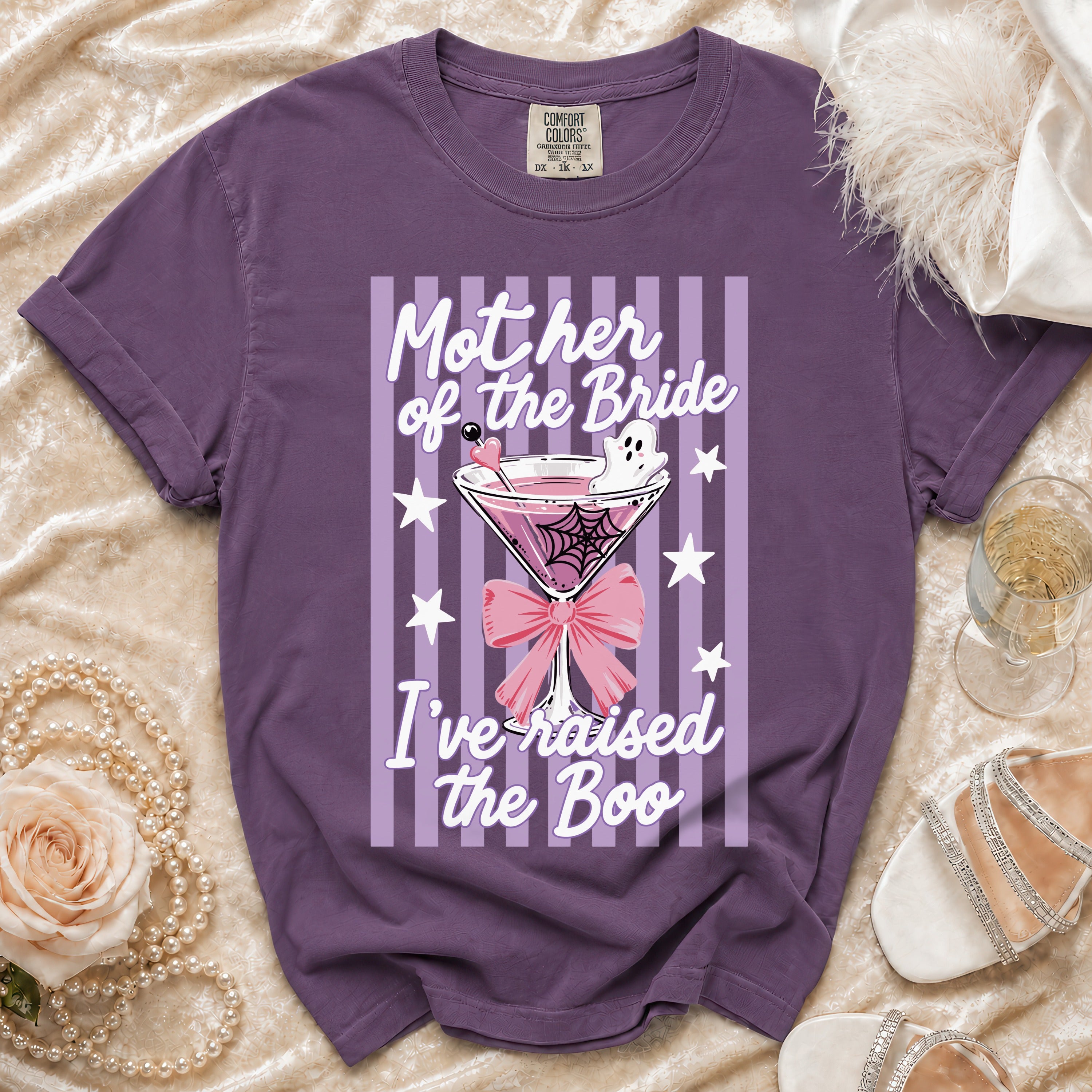 Purple t-shirt with "Mother of the Bride I've raised the Boo" text and Halloween cocktail graphic.