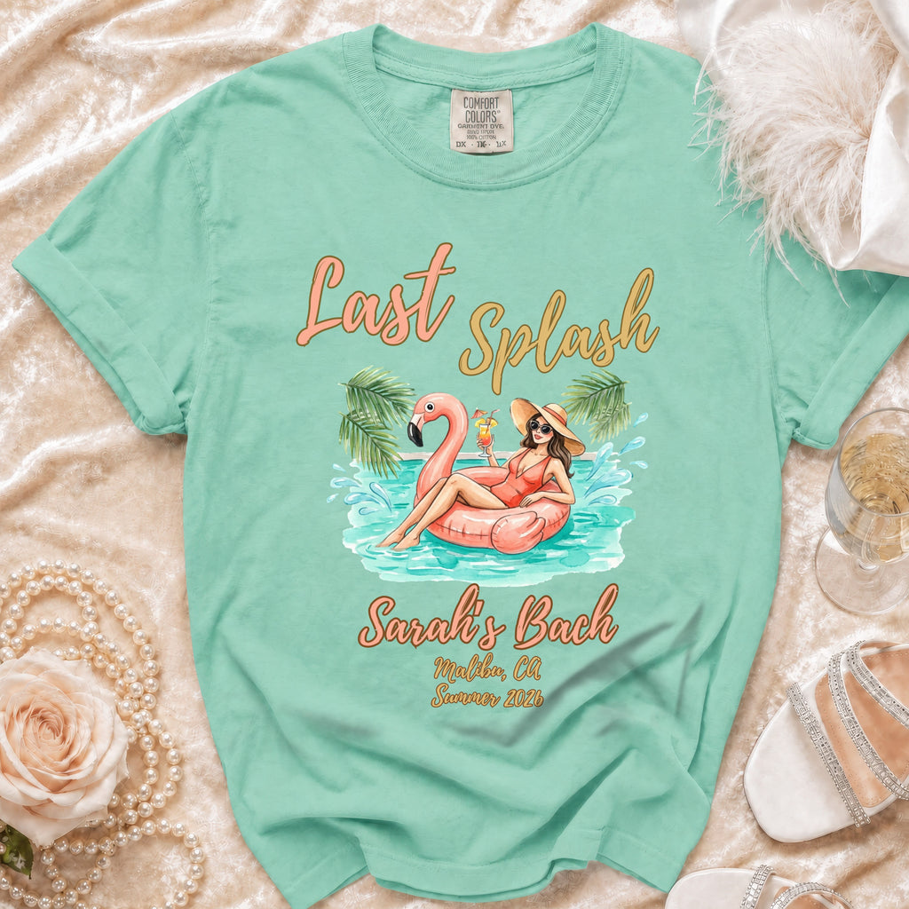 Aqua t-shirt with "Last Splash" and flamingo pool float graphic.