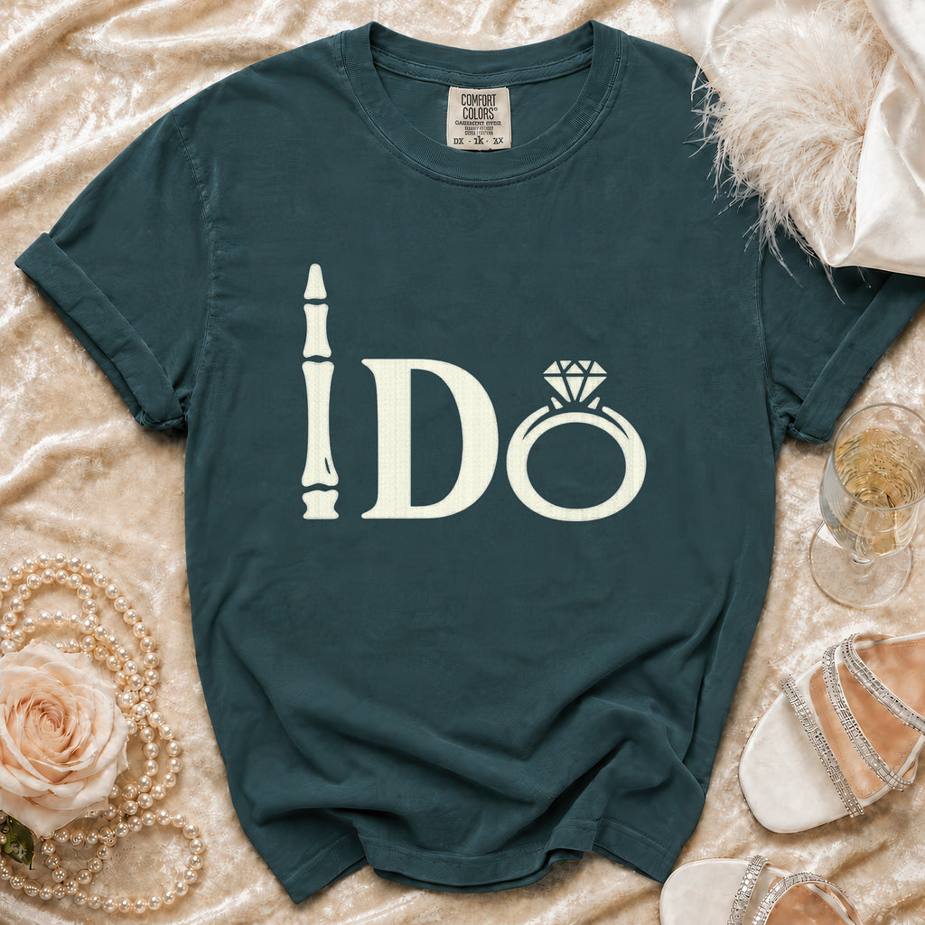 Teal t-shirt with ivory "I Do" text, ring graphic, and tag at neckline.