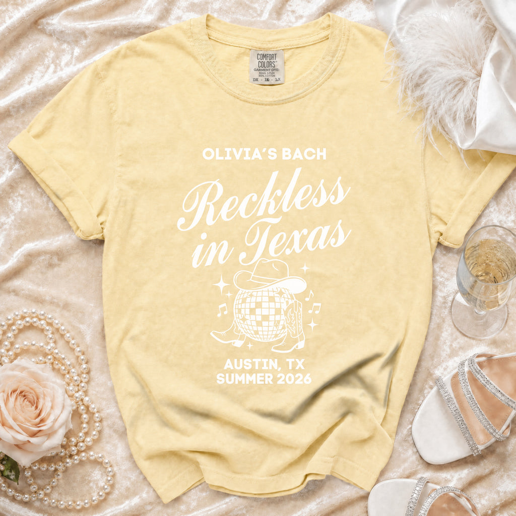 Yellow t-shirt with "Olivia's Bach Reckless in Texas Austin, TX Summer 2026" text.