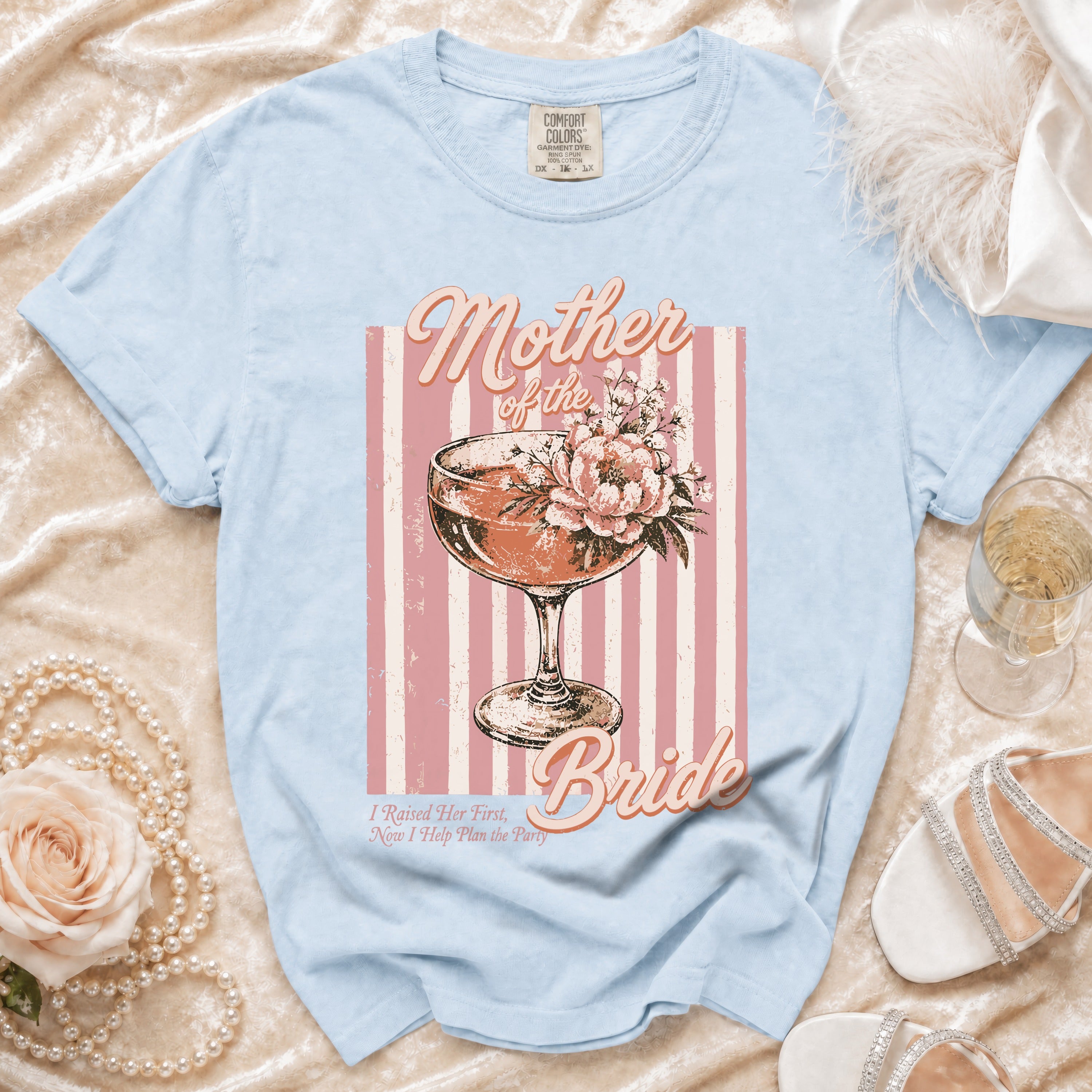 Light blue t-shirt with "Mother of the Bride" and floral cocktail graphic.