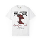 White t-shirt with "Her Last Rodeo" and cowboy boot graphic.