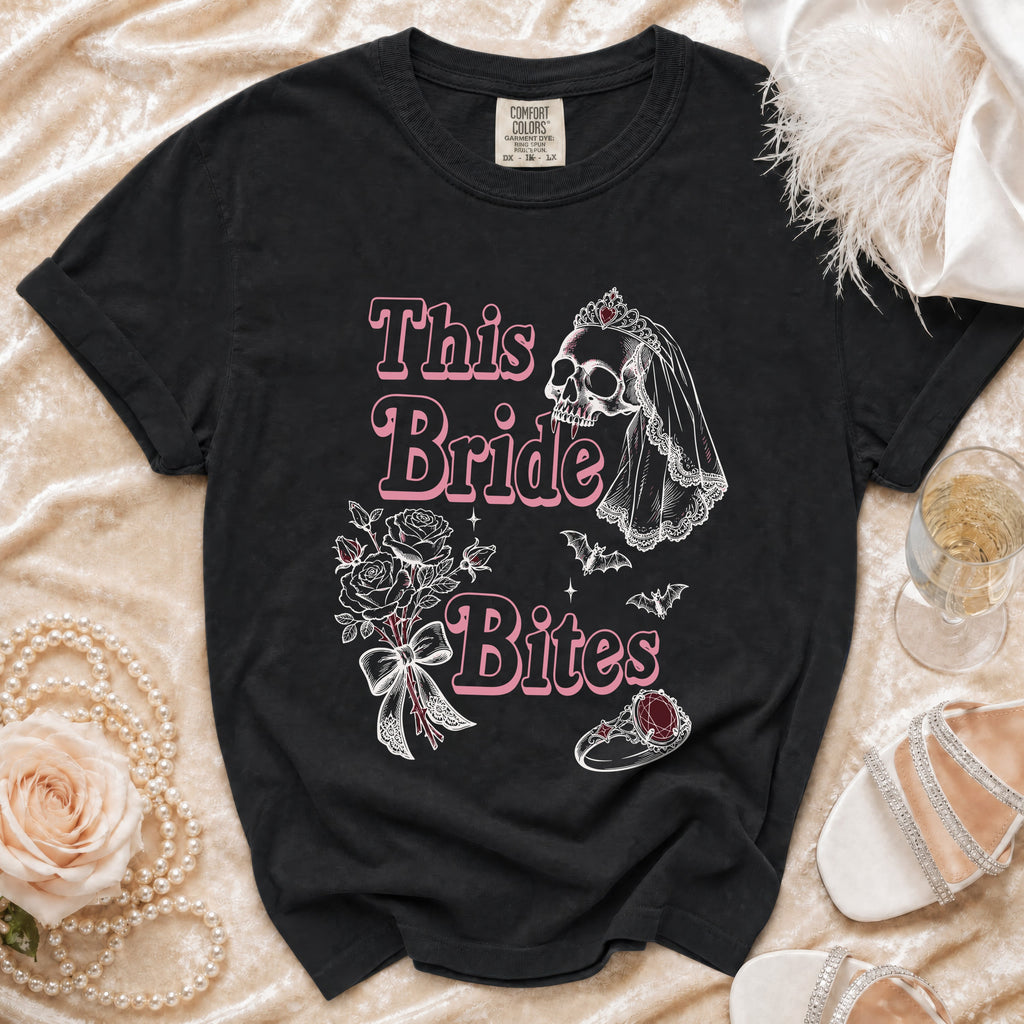 Black t-shirt with "This Bride Bites" text, skull, bats, and wedding ring graphic.