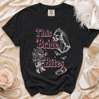 Black t-shirt with "This Bride Bites" text, skull, bats, and wedding ring graphic.
