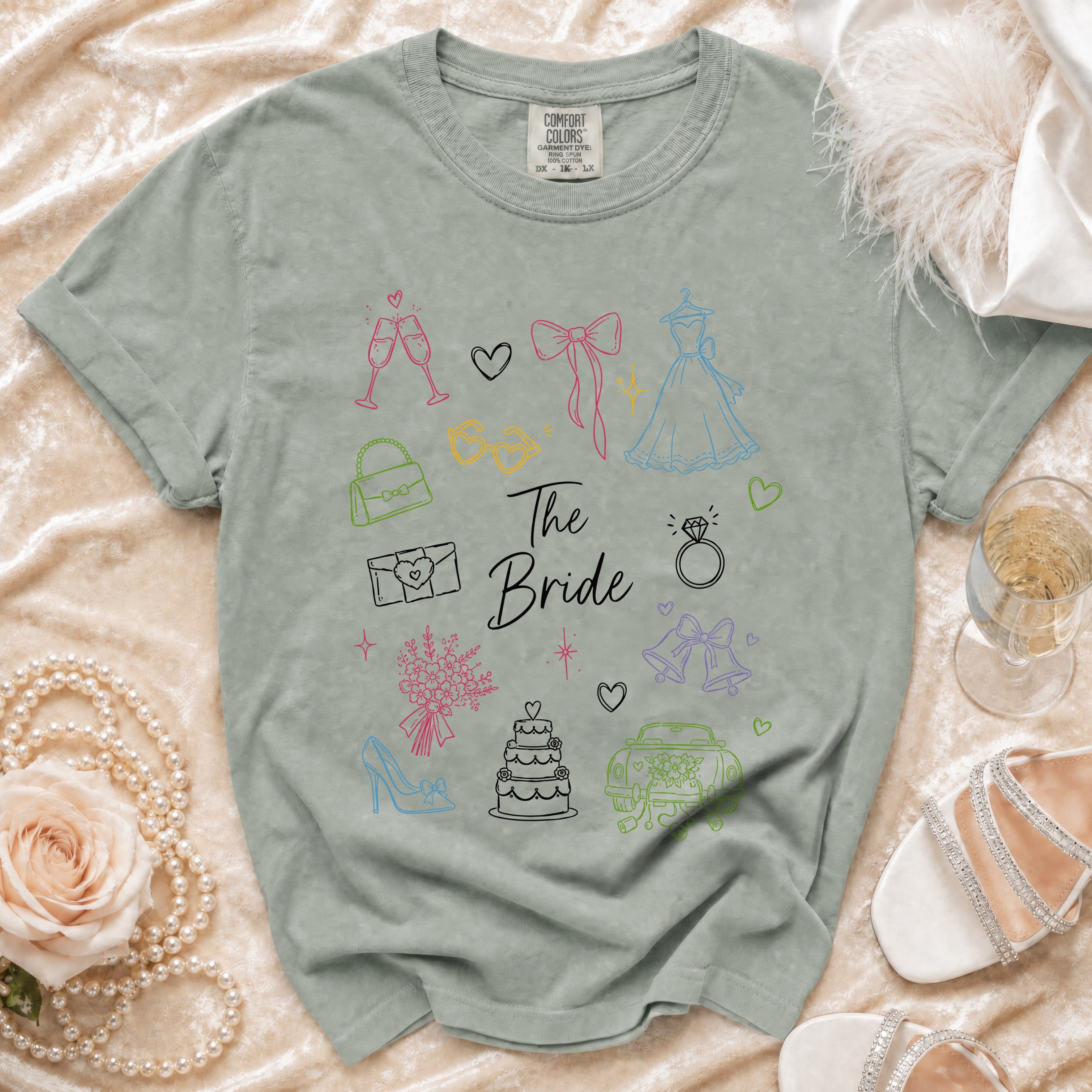 Green t-shirt with "The Bride" text and wedding icons.