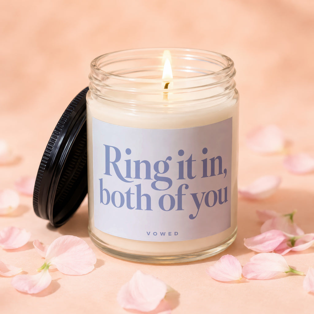 Lit candle in a glass jar with "Ring it in, both of you" text and "VOWED" below.