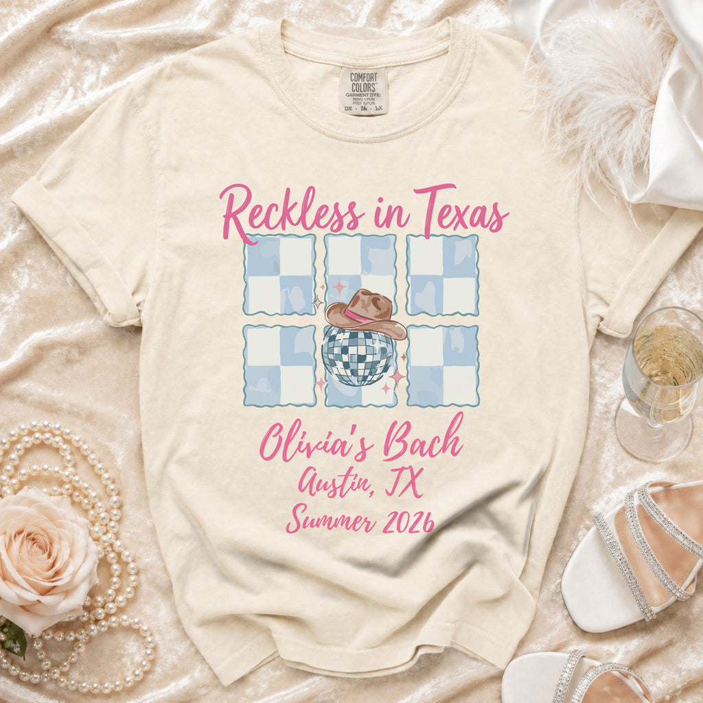 Comfort Colors t-shirt with "Reckless in Texas Olivia's Bach Austin, TX Summer 2026" text.