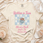 Comfort Colors t-shirt with "Reckless in Texas Olivia's Bach Austin, TX Summer 2026" text.