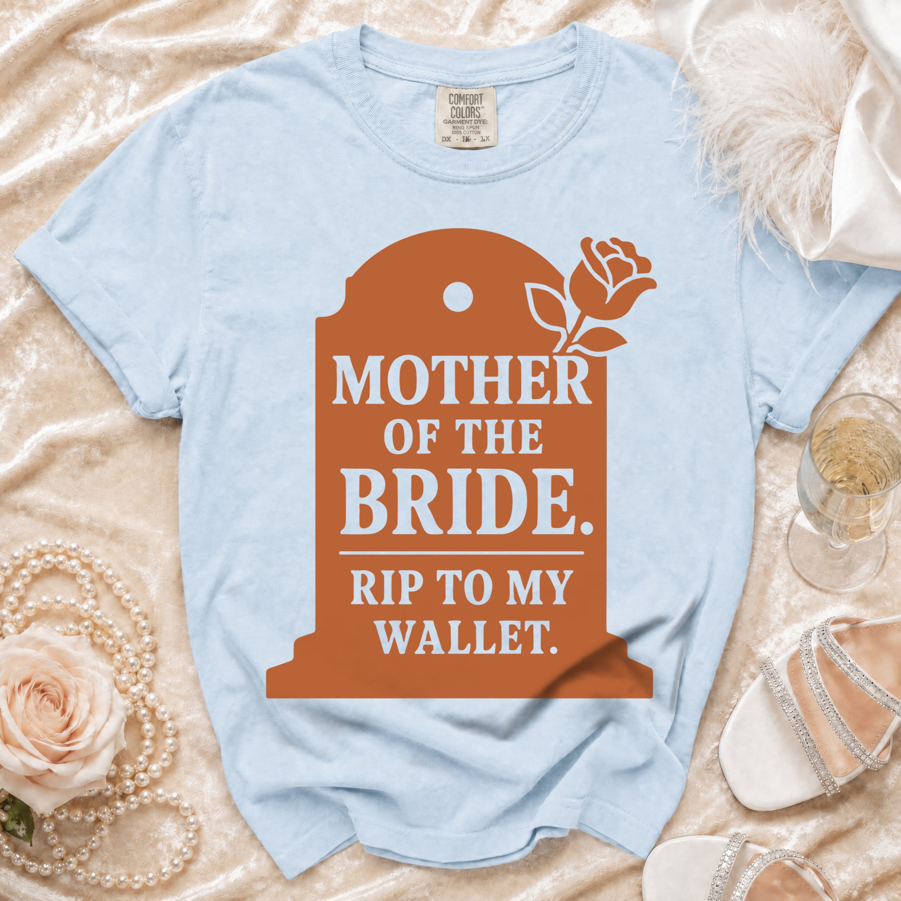 Light blue t-shirt with tombstone graphic reading "MOTHER OF THE BRIDE. RIP TO MY WALLET."