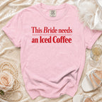 Pink t-shirt with "This Bride needs an Iced Coffee" text in red.