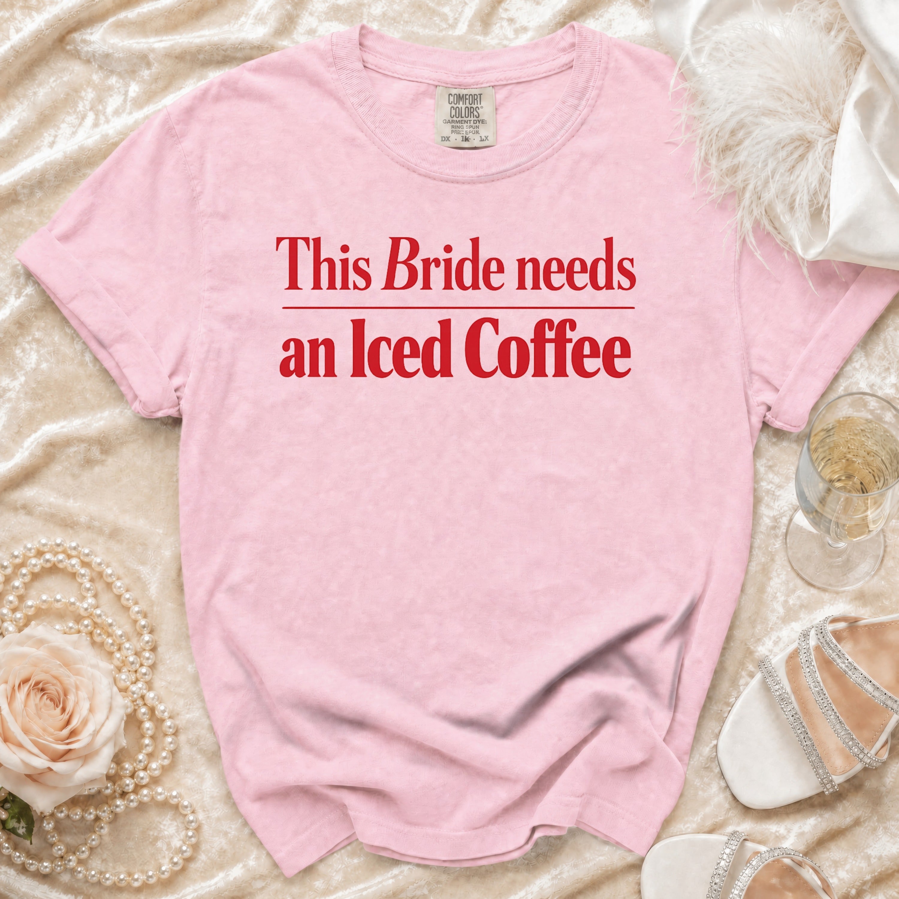 Pink t-shirt with "This Bride needs an Iced Coffee" text in red.
