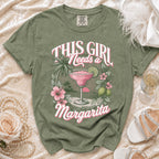 Olive green t-shirt with "This Girl Needs a Margarita" graphic.