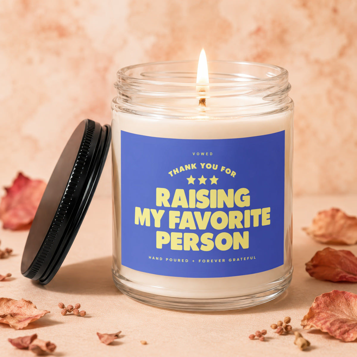 Candle with blue label reading "Thank You For Raising My Favorite Person."