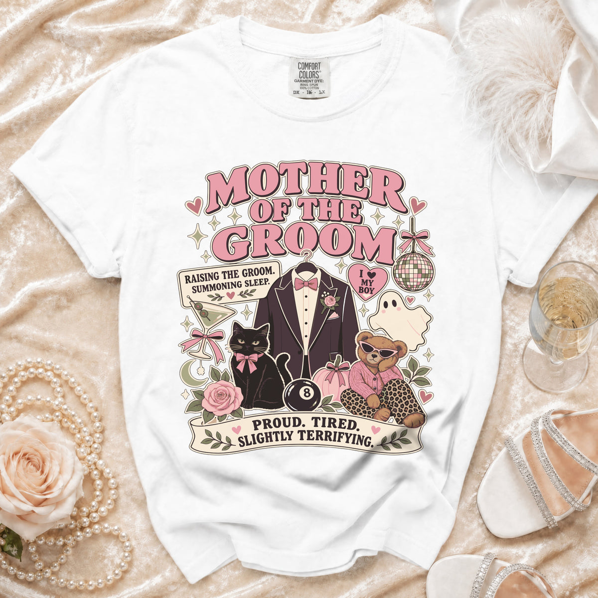White t-shirt with "Mother of the Groom" design featuring a cat, bear, and suit.