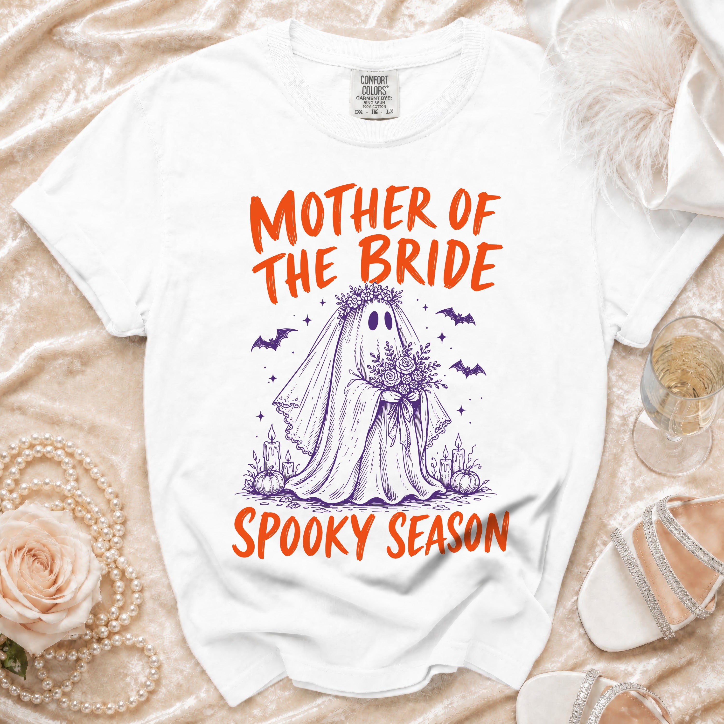 White t-shirt with "Mother of the Bride Spooky Season" text and ghost graphic.