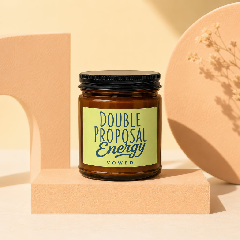 Brown candle in a jar with a lime green label reading "DOUBLE PROPOSAL ENERGY VOWED".
