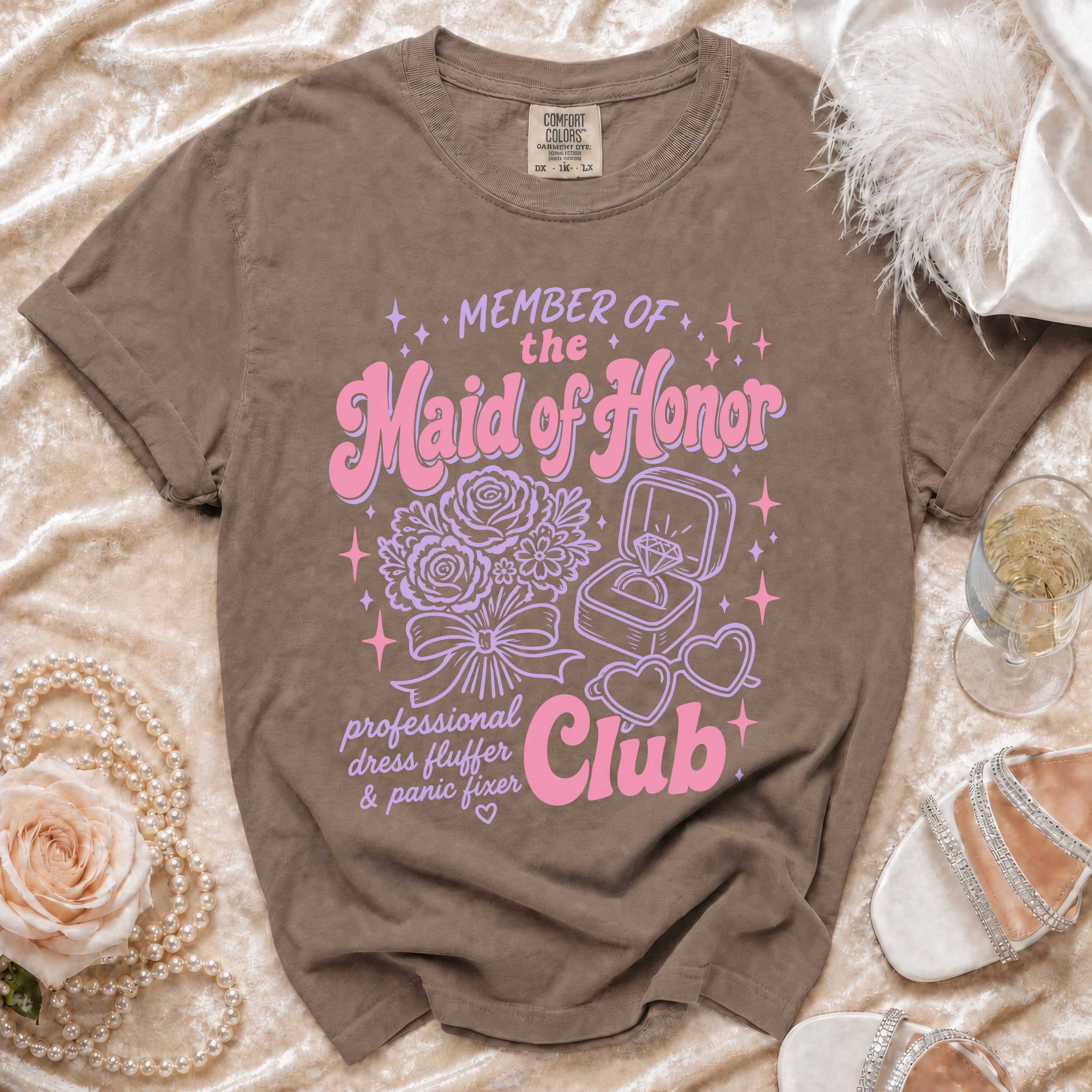 Brown Comfort Colors t-shirt with "Member of the Maid of Honor Club" graphic.