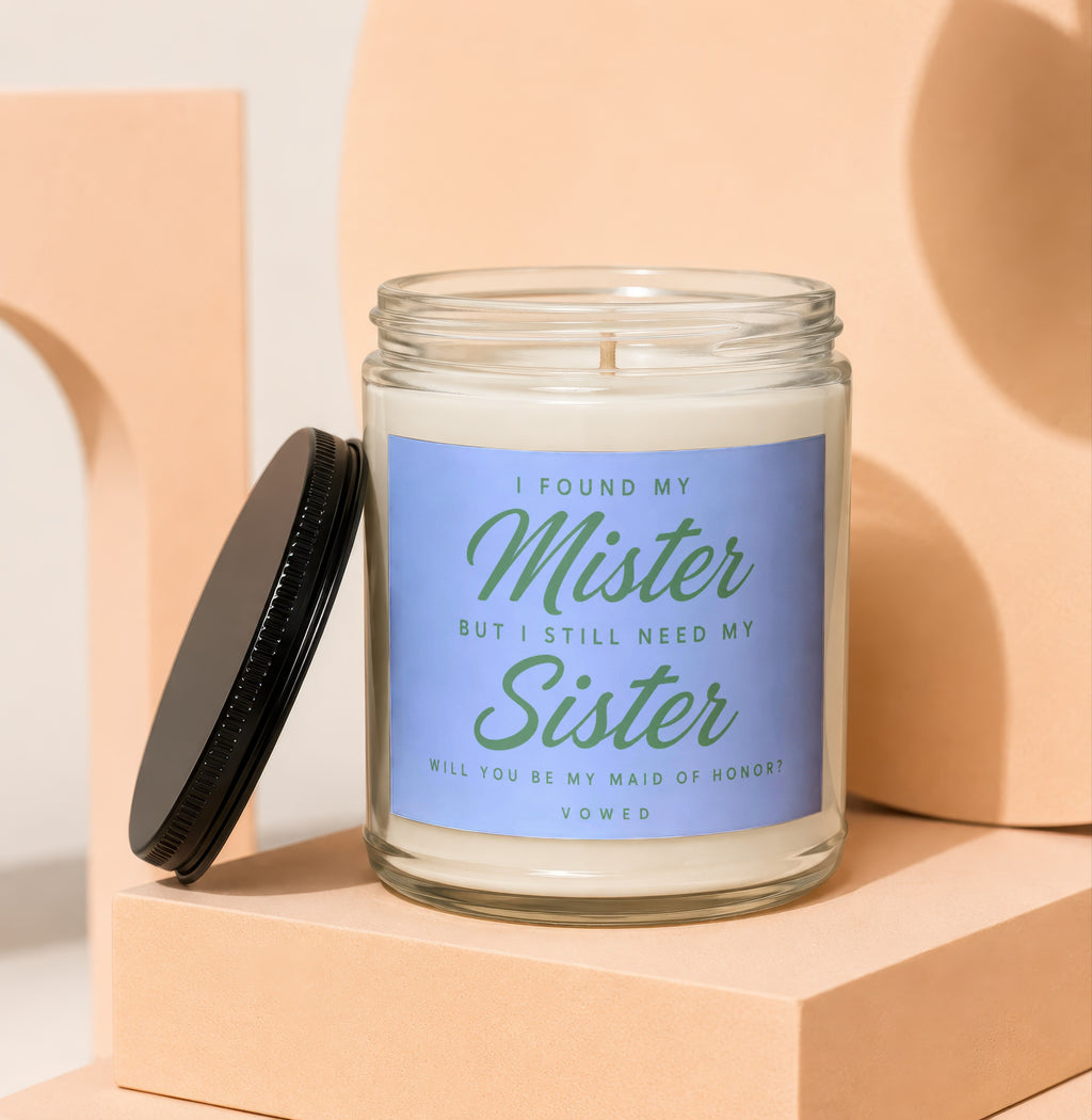Glass candle with "I Found My Mister But I Still Need My Sister" text.