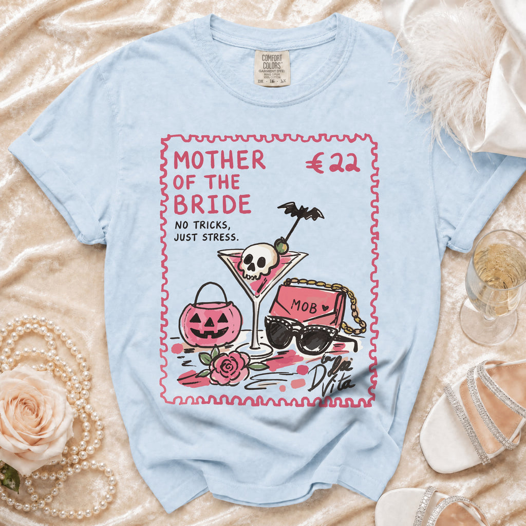 Light blue t-shirt with "Mother of the Bride" text and illustrated accessories.