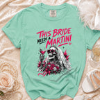Mint t-shirt with skeleton bride graphic and "THIS BRIDE NEEDS A MARTINI" text.