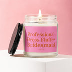 Jar candle with pink label reading "Professional Dress Fluffer Bridesmaid Vowed".