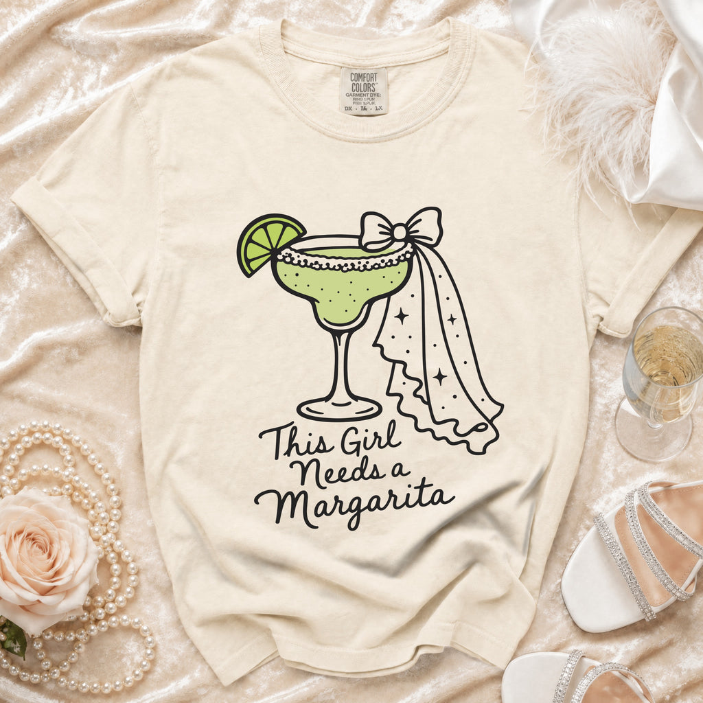 T-shirt with margarita graphic and text "This Girl Needs a Margarita".
