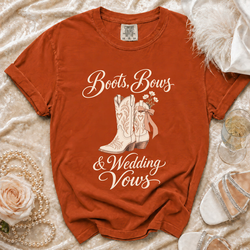 Rust-colored t-shirt with "Boots, Bows & Wedding Vows" text and cowboy boots graphic.