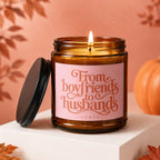 Amber candle with a pink label that reads "From boyfriends to husbands VOWED".