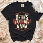 Black t-shirt with "Bride's Fabulous Nana" text, pearl necklace, rose, and heels.