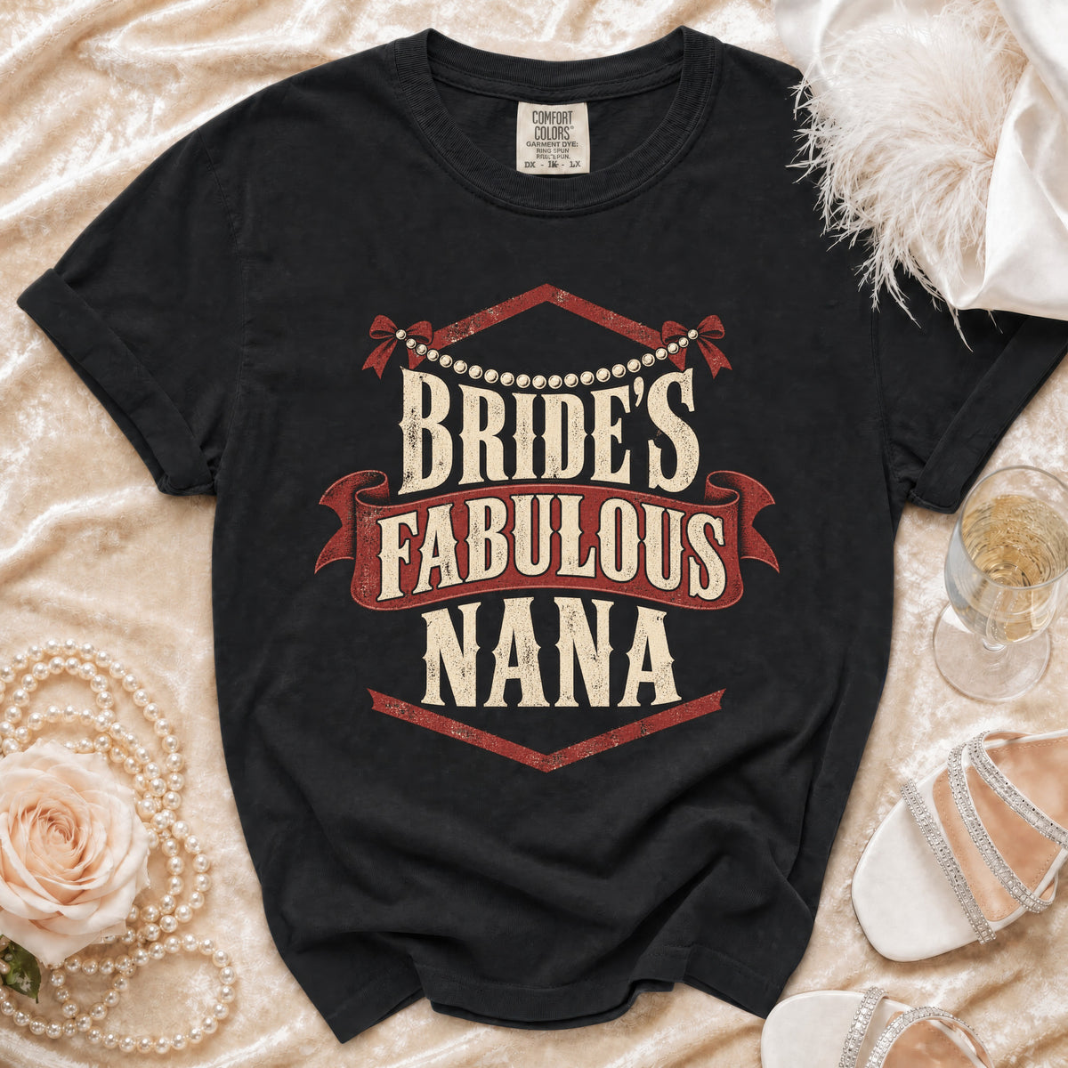 Black t-shirt with "Bride's Fabulous Nana" text, pearl necklace, rose, and heels.