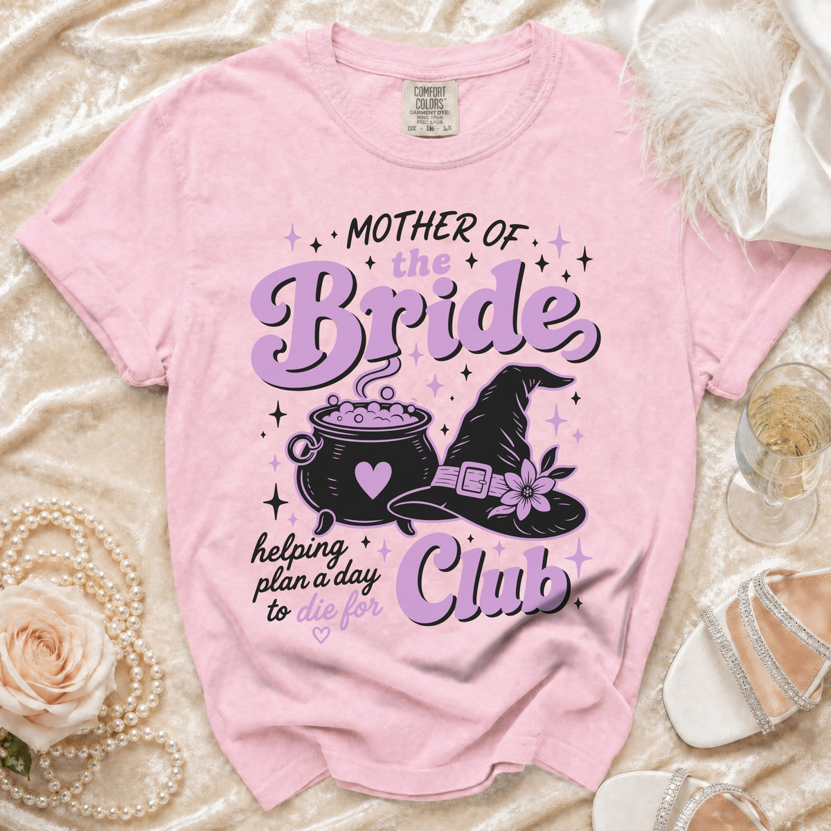 Pink t-shirt with "Mother of the Bride Club" text, cauldron, and witch hat.