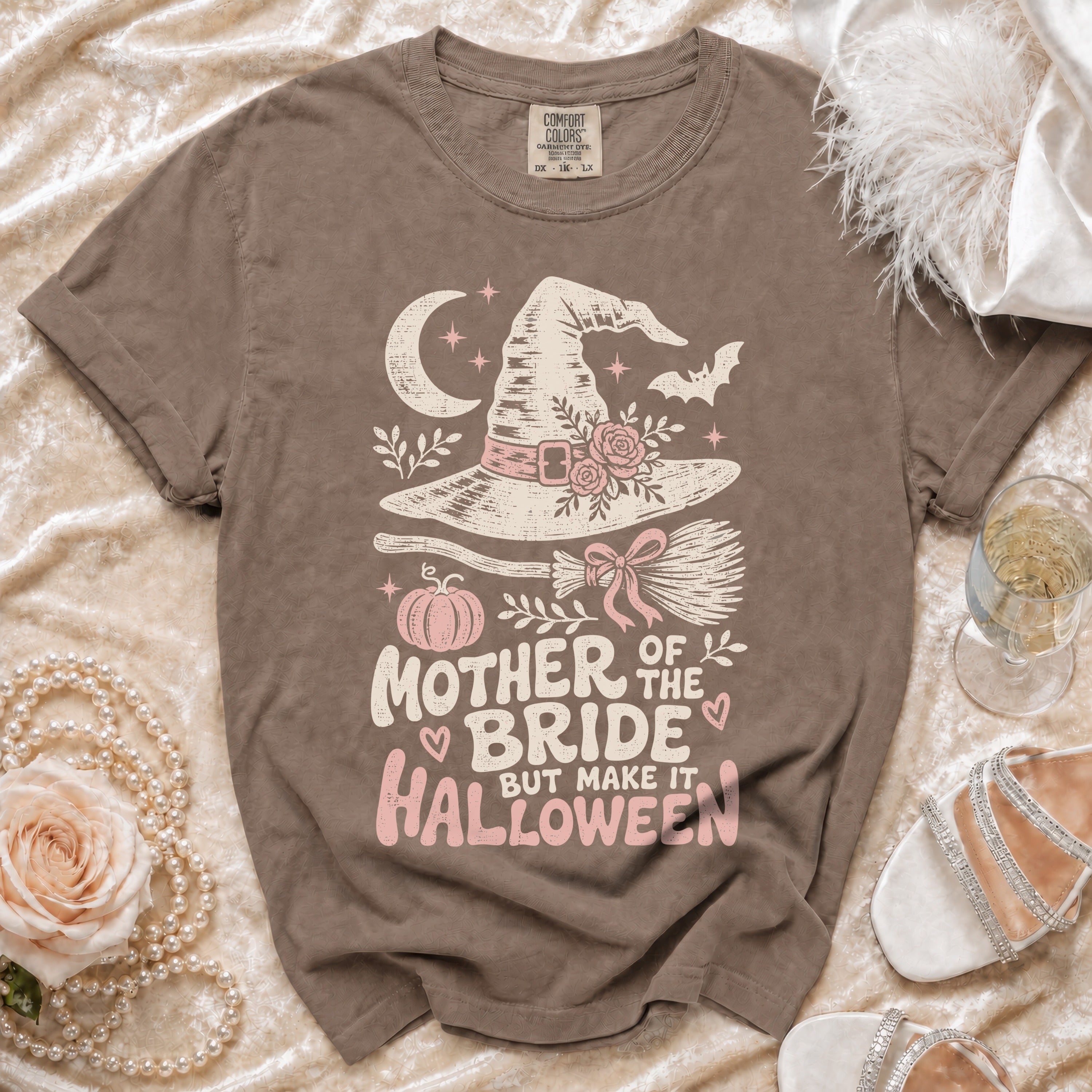 Brown t-shirt with "Mother of the Bride but make it Halloween" text and witch hat design.