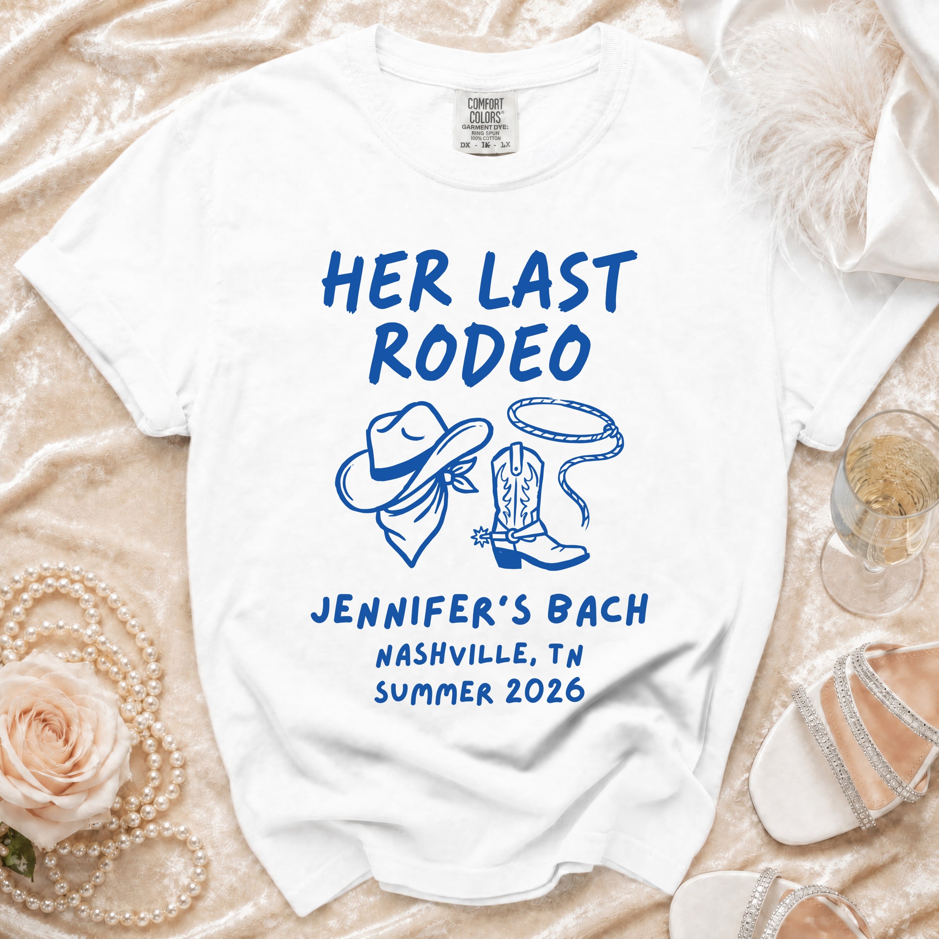 White t-shirt with "Her Last Rodeo Jennifer's Bach Nashville TN Summer 2026" in blue.