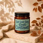 Amber candle with "Our Love Story Ends Continues" text, "vowed" below.