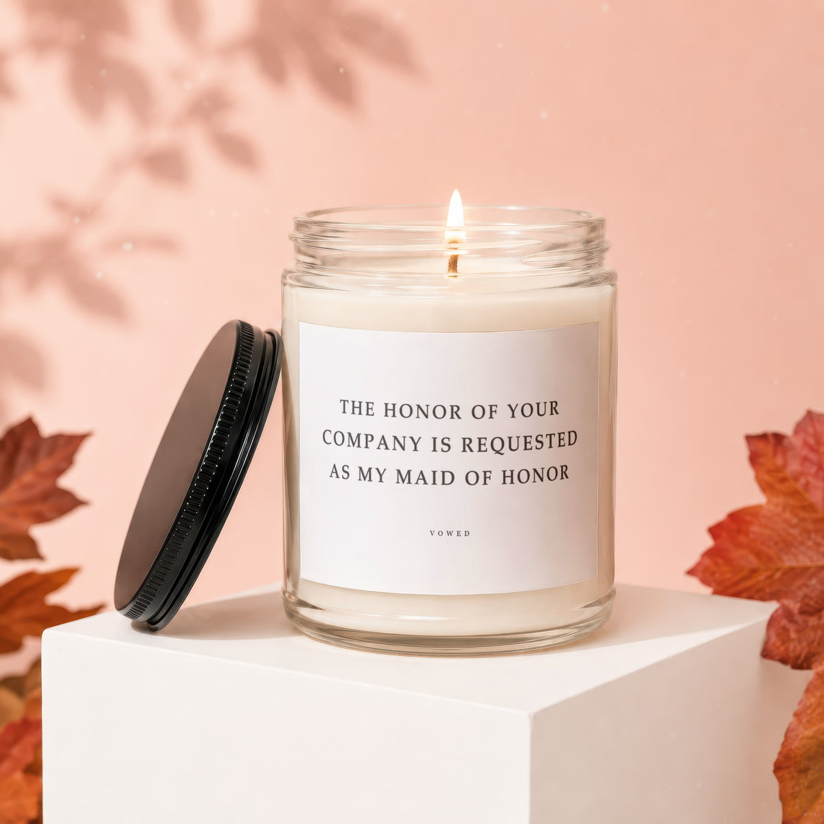 Candle with text "The honor of your company is requested as my maid of honor".