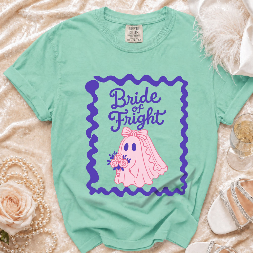 Aqua t-shirt with "Bride of Fright" text and pink ghost bride holding bouquet.