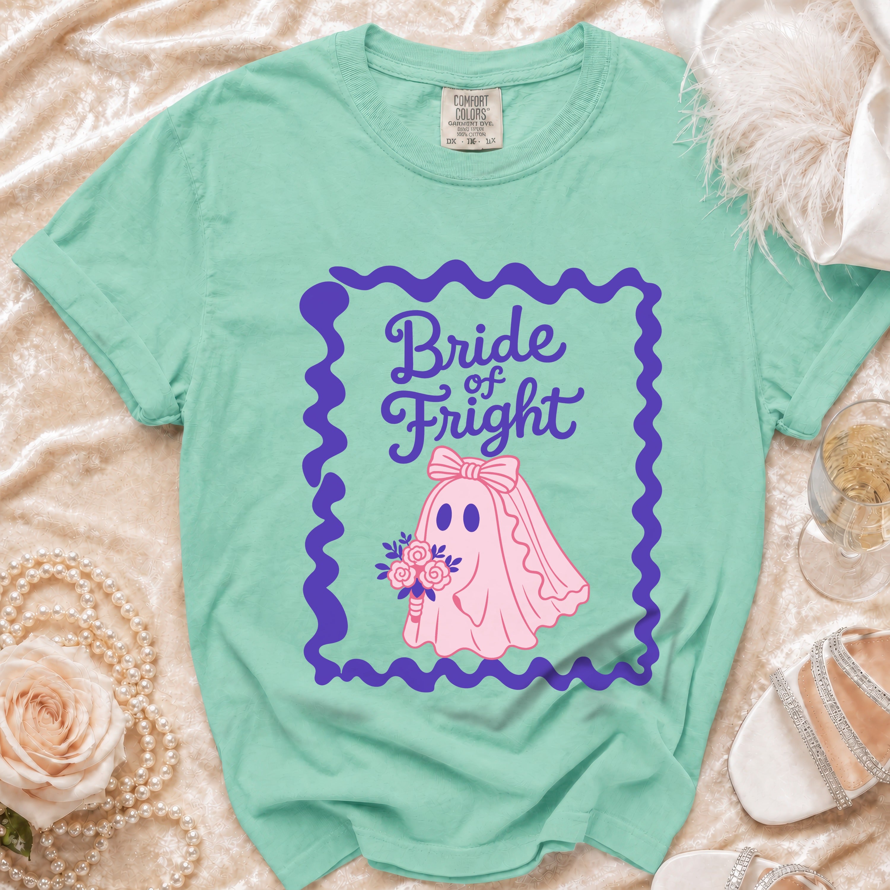 Aqua t-shirt with "Bride of Fright" text and pink ghost bride holding bouquet.