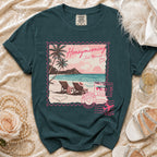 Teal t-shirt with a postage stamp graphic featuring a beach scene, palm trees, and "Honeymooning Just Married" text.