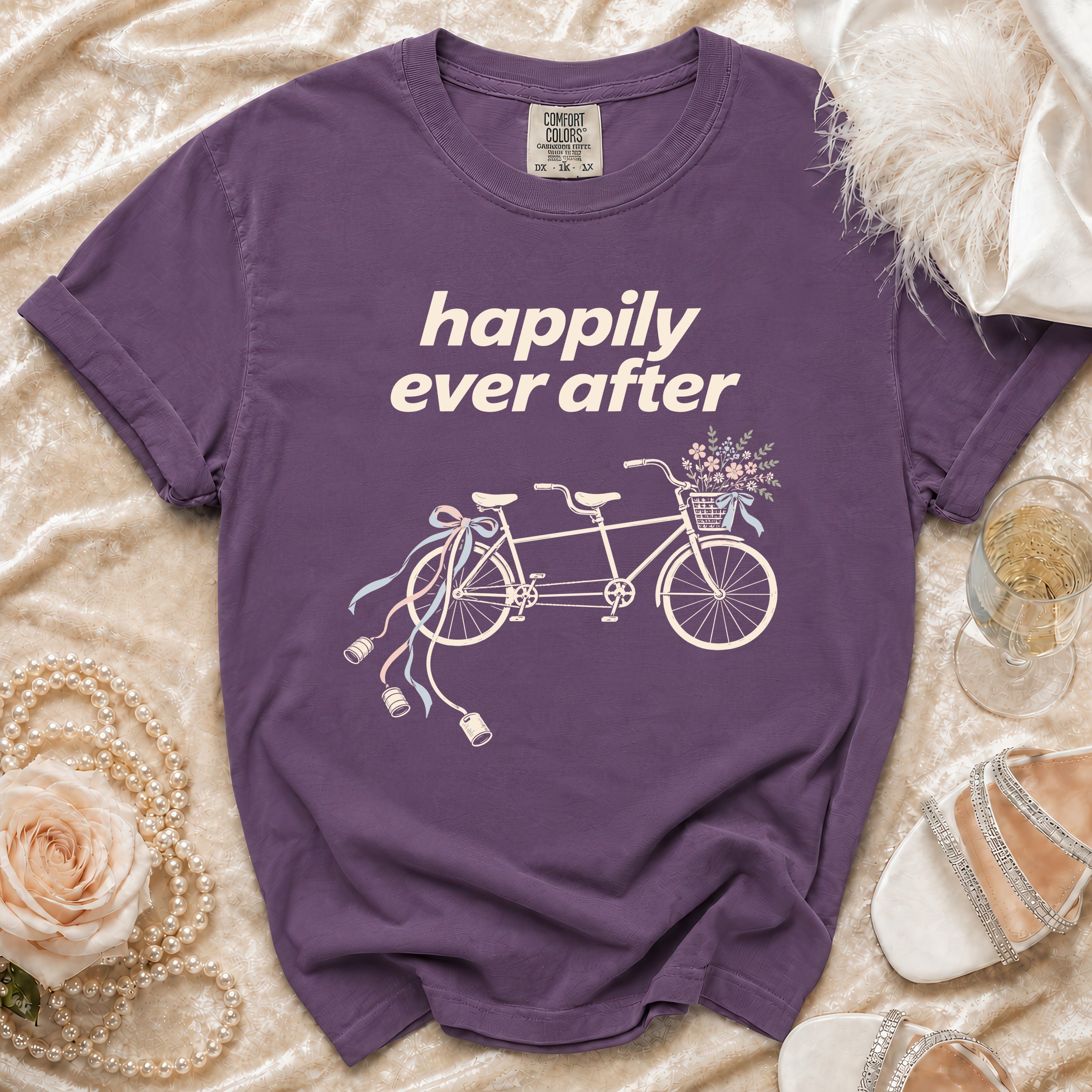 Purple t-shirt with "happily ever after" and a tandem bicycle graphic.