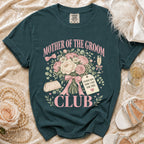Teal t-shirt with "Mother of the Groom Club" text and floral design.