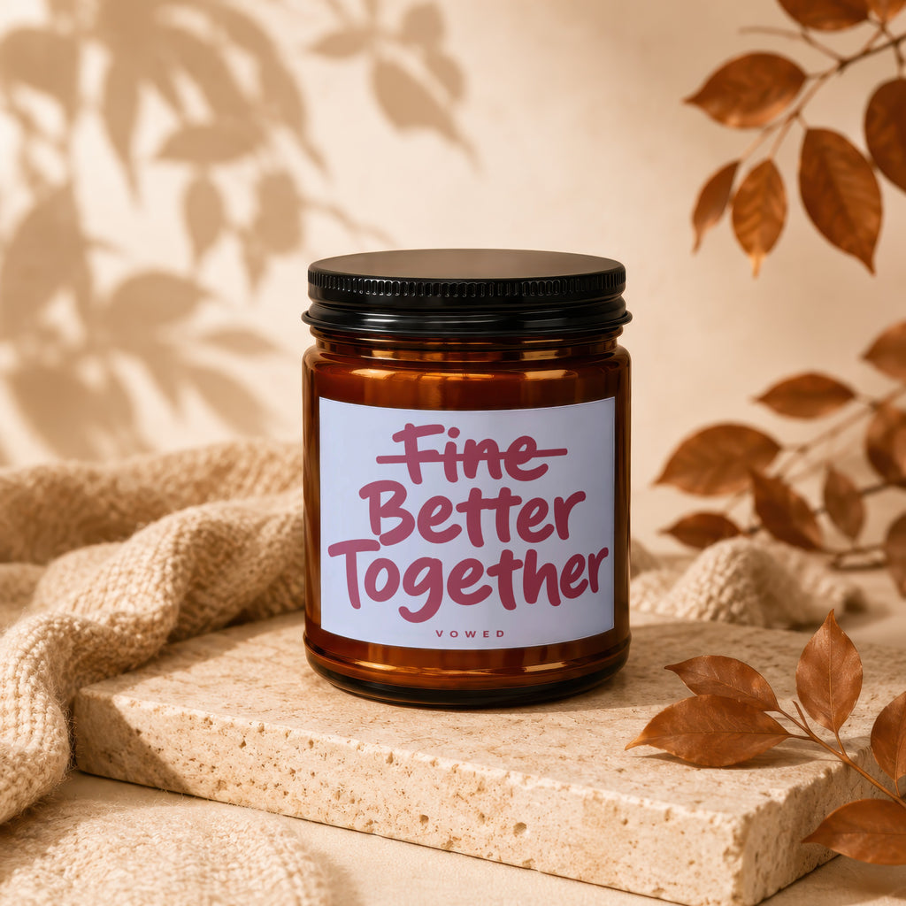 Amber candle with "Fine Better Together" text on label, with autumnal decor.
