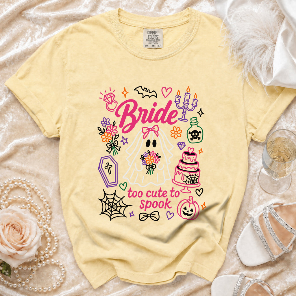 Yellow t-shirt with "Bride" and "too cute to spook" Halloween graphics.
