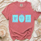 Coral t-shirt with "Last Splash" text and bachelorette icons: bouquet, cocktail, champagne.