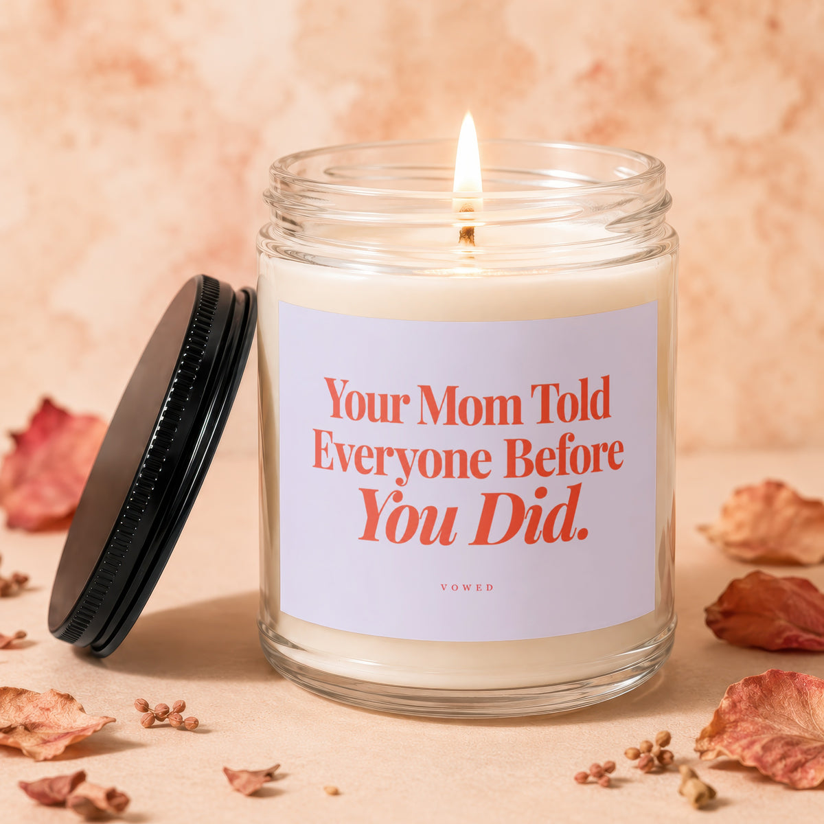 Candle with text "Your Mom Told Everyone Before You Did." and brand "VOWED".