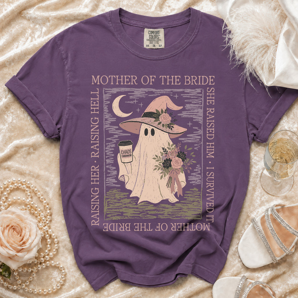 Purple t-shirt with a ghost wearing a witch hat and holding a coffee, reading "Chaos Coordinator."