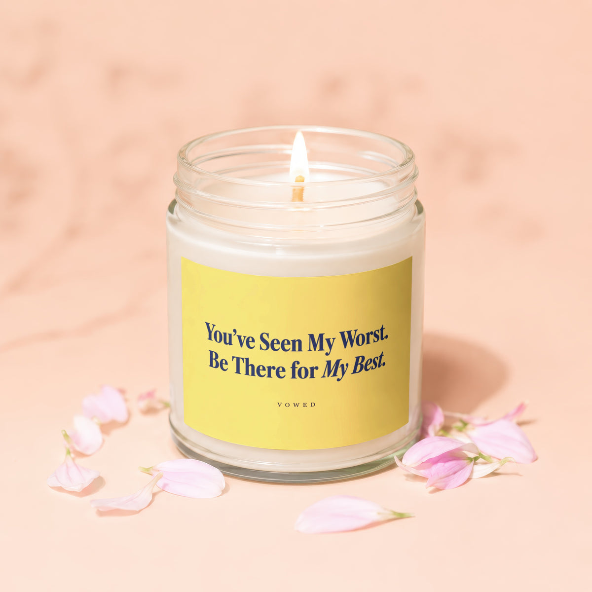 Jar candle with yellow label saying "You've Seen My Worst. Be There for My Best. VOWED."