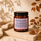 Candle labeled "Officially Engaged Married Took Long Enough Vowed."
