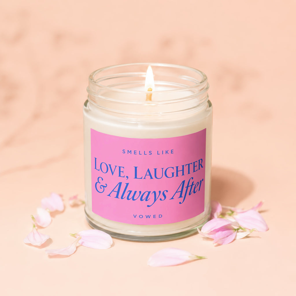 Vowed candle with pink label reading "Smells like Love, Laughter & Always After".