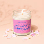 Vowed candle with pink label reading "Smells like Love, Laughter & Always After".